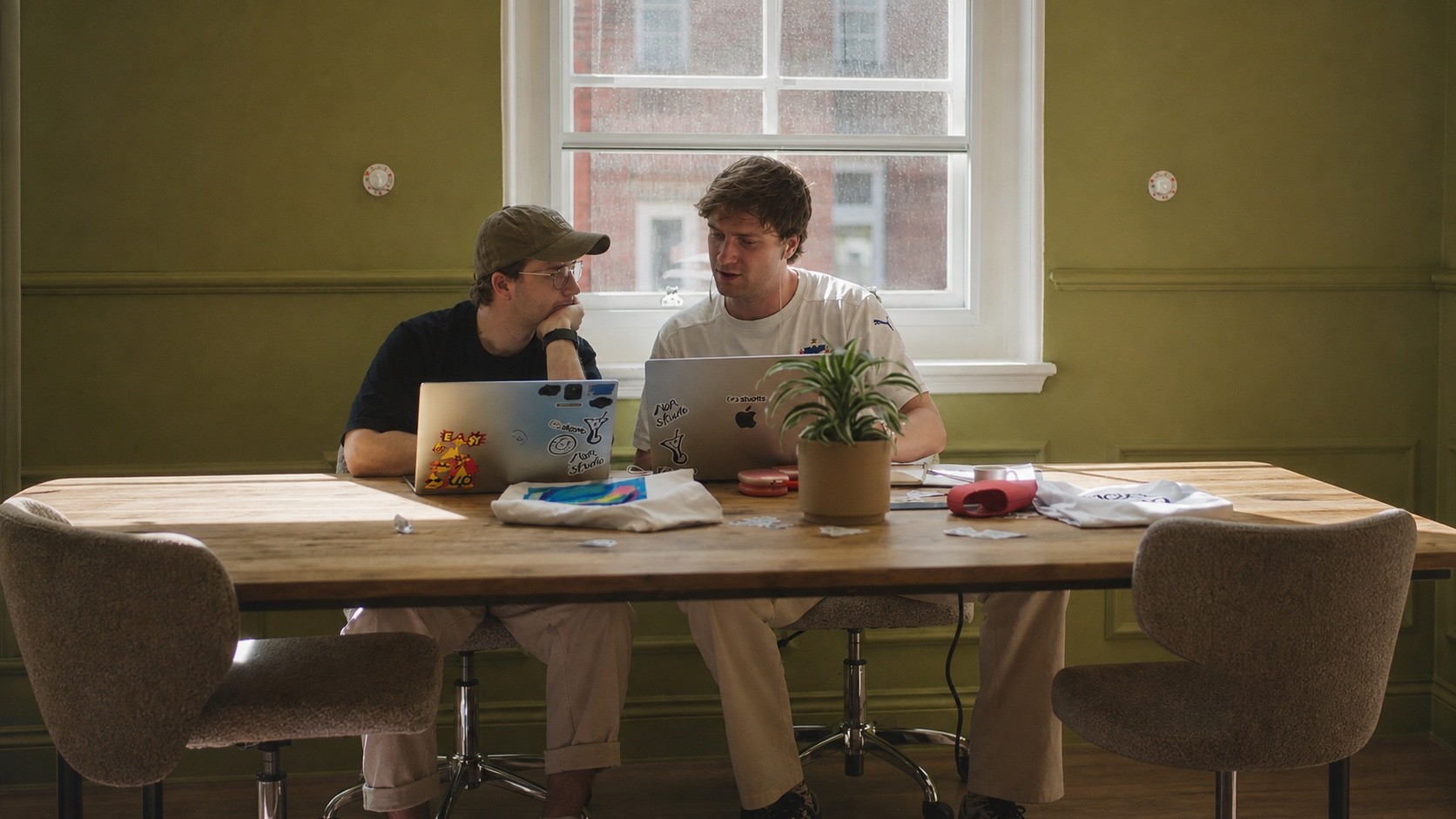 Skarlo founders Luca and Rowan working together on laptops