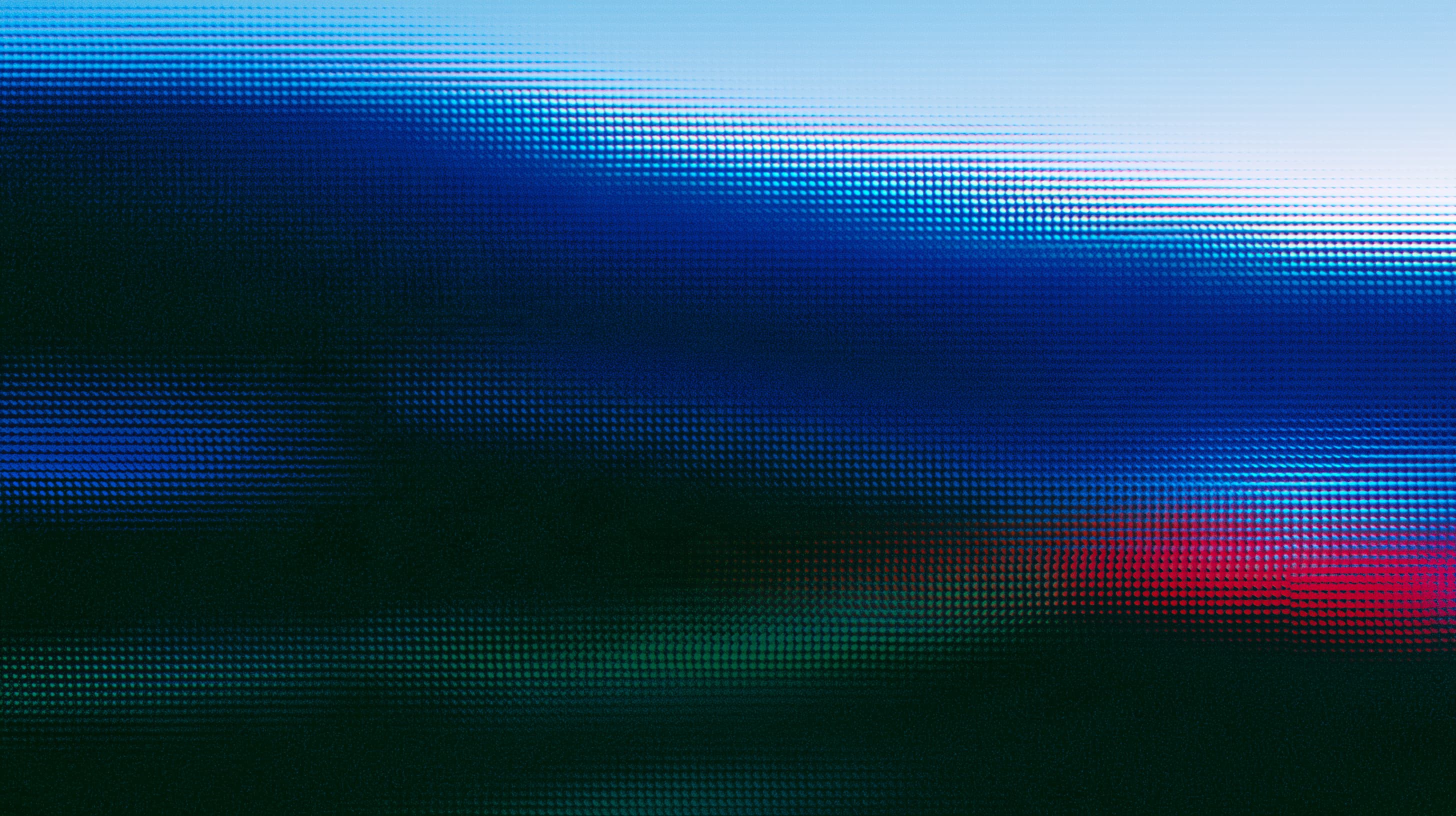 Abstract blue, green, and pink light patterns on a dark background